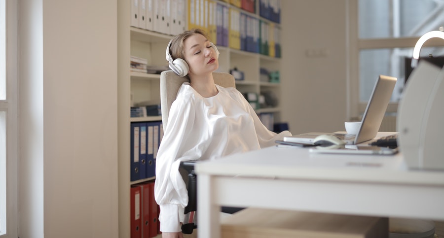 lady listening to music while working.
