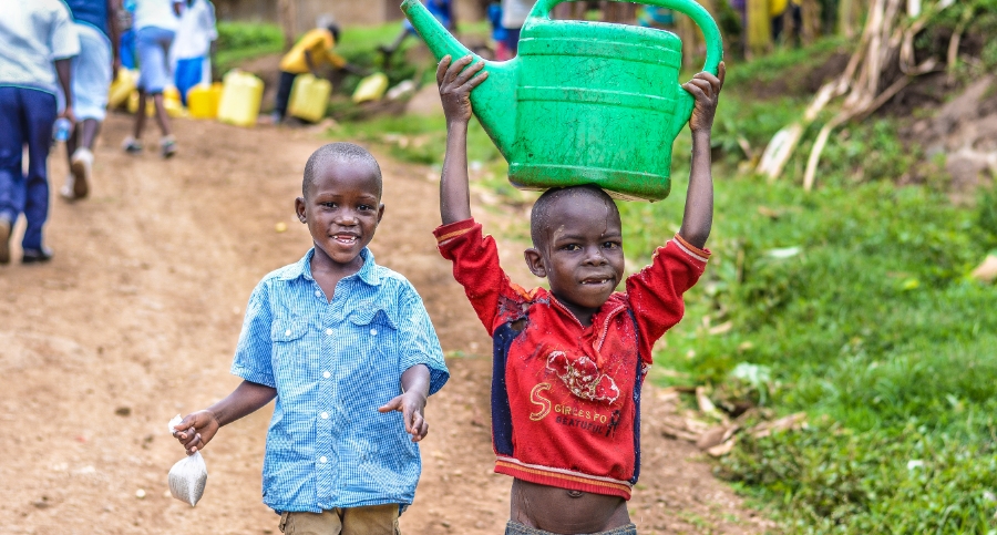 malnourished children in Sub-saharan Africa, carrying can
