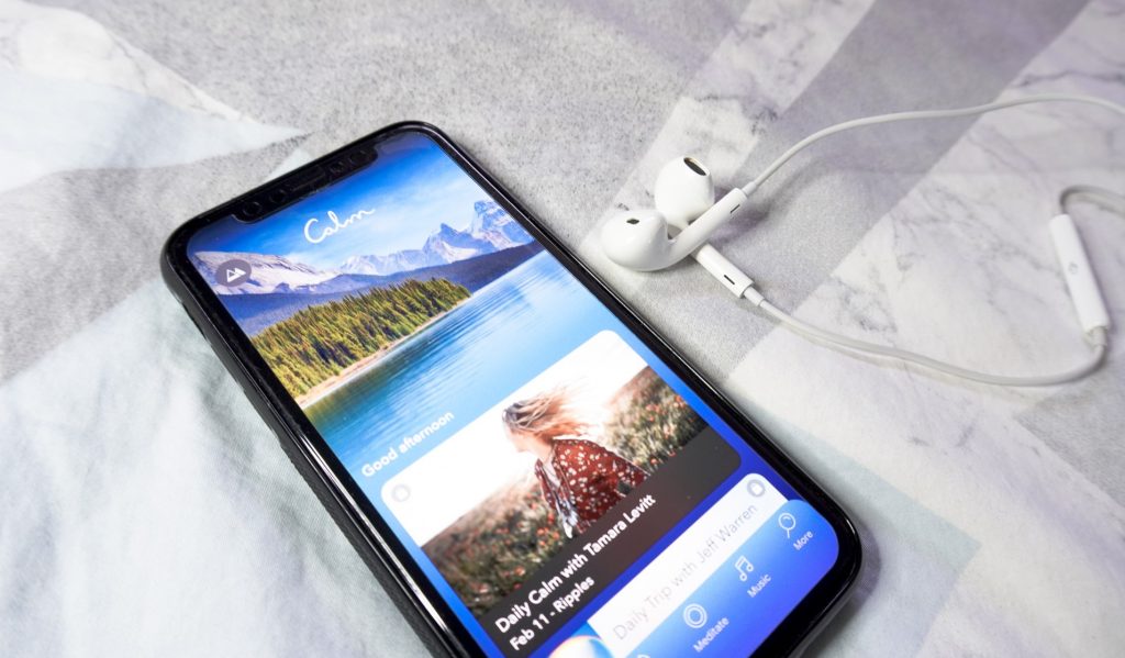 iPhone showing the opening screen of Calm for healthy living in self-care.