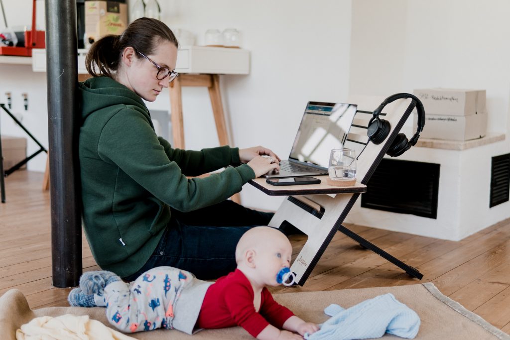 woman working from home with baby