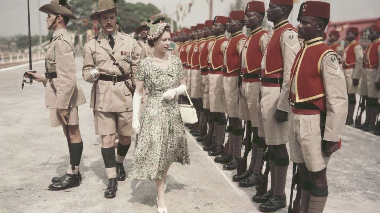Queen Elizabether II inspects soldiers in Nigeria.