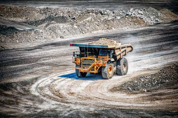 An open-cut coal mine in Queensland's coal basin, where the earth's materials and minerals (rocks, soil and water) are drained.